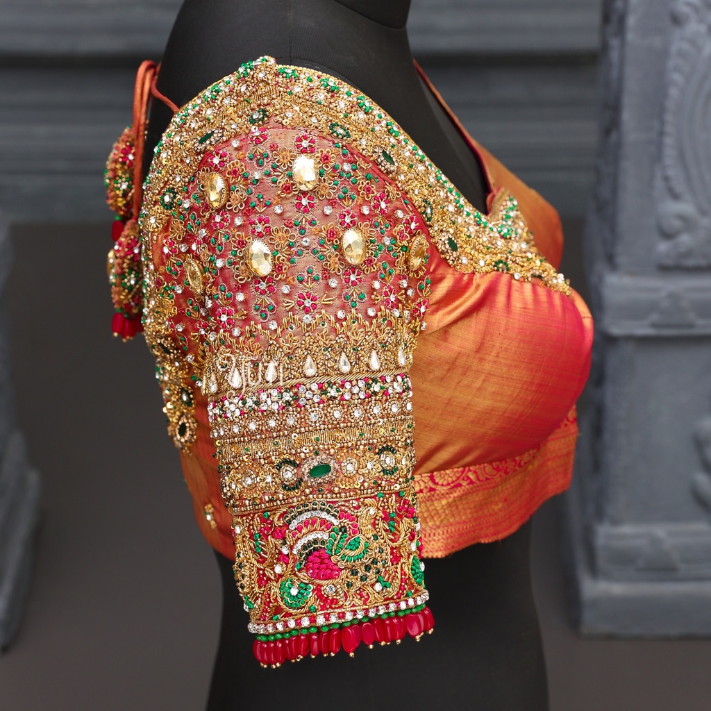 Orange-colored masterpiece of bridal blouse