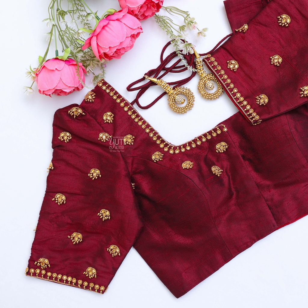 Elegant and chic in this wine red embroidery blouse