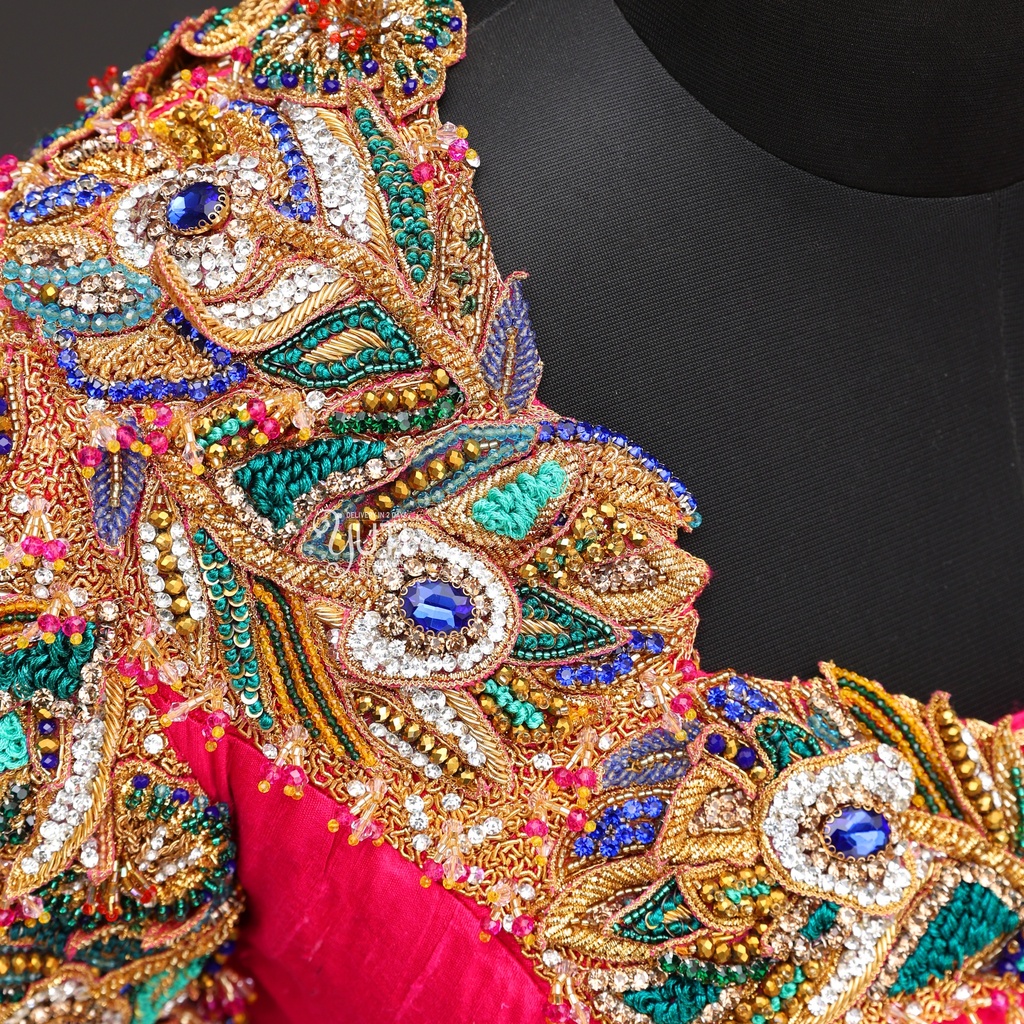 The allure of peacock-inspired embroidery on our elegant bridal blouse