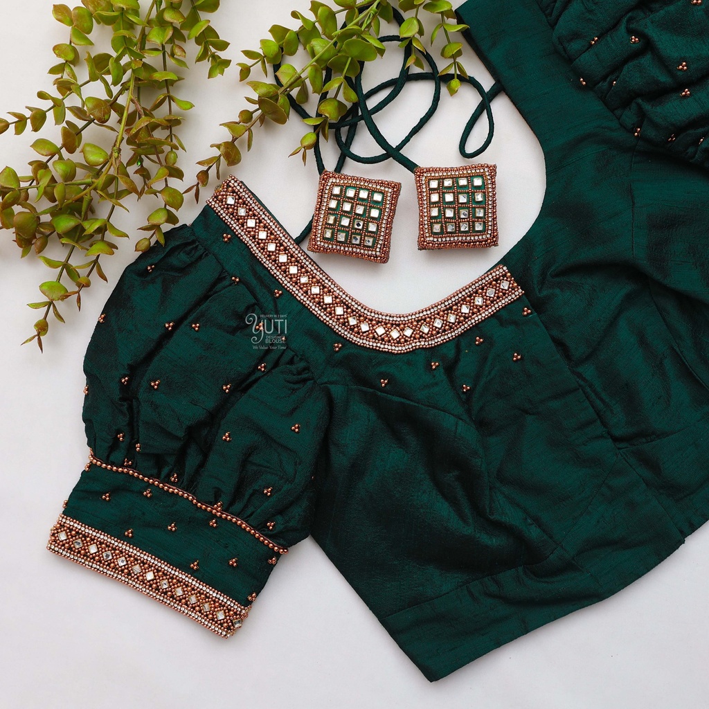 Featuring intricate green color embroidery bridal blouse