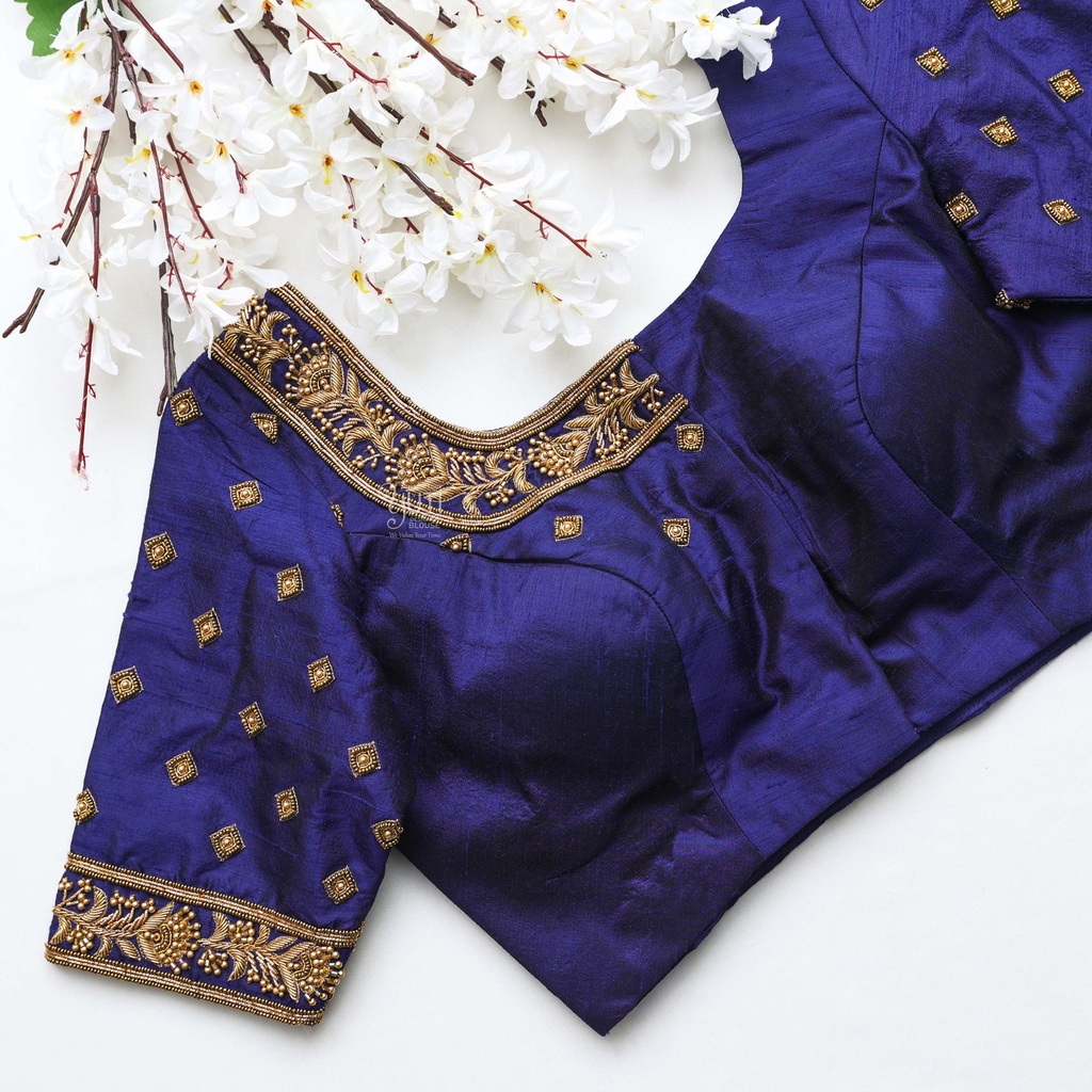 the perfect dark blue bridal blouse with stunning golden embroidery work