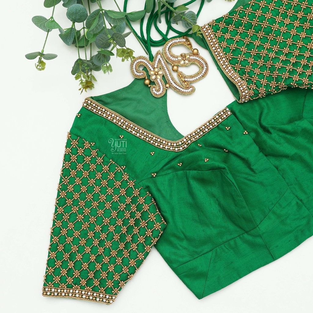 Fashionable in this shamrock green designer blouse