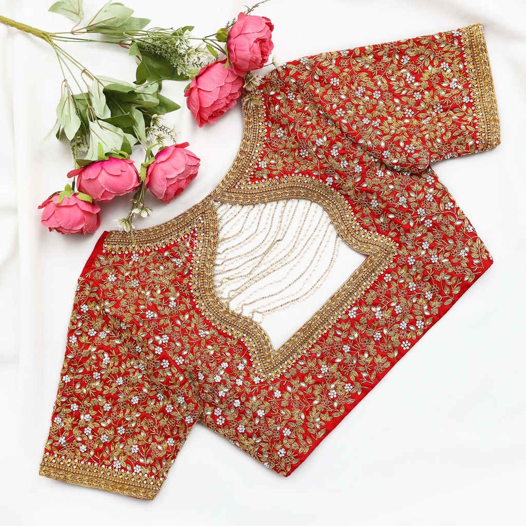 Festive red blouse embellished with gold sequins and lovely flowers.