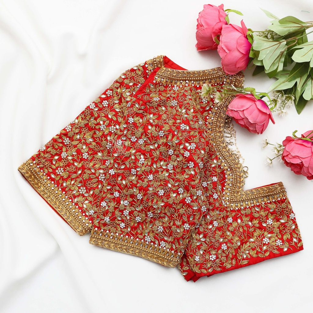 Festive red blouse embellished with gold sequins and lovely flowers.