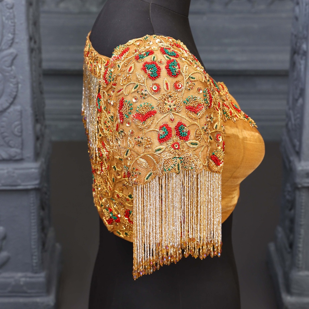 Stunning gold and red blouse.