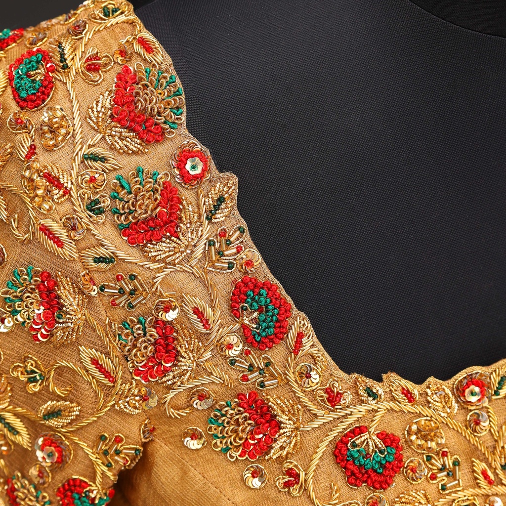 Stunning gold and red blouse.