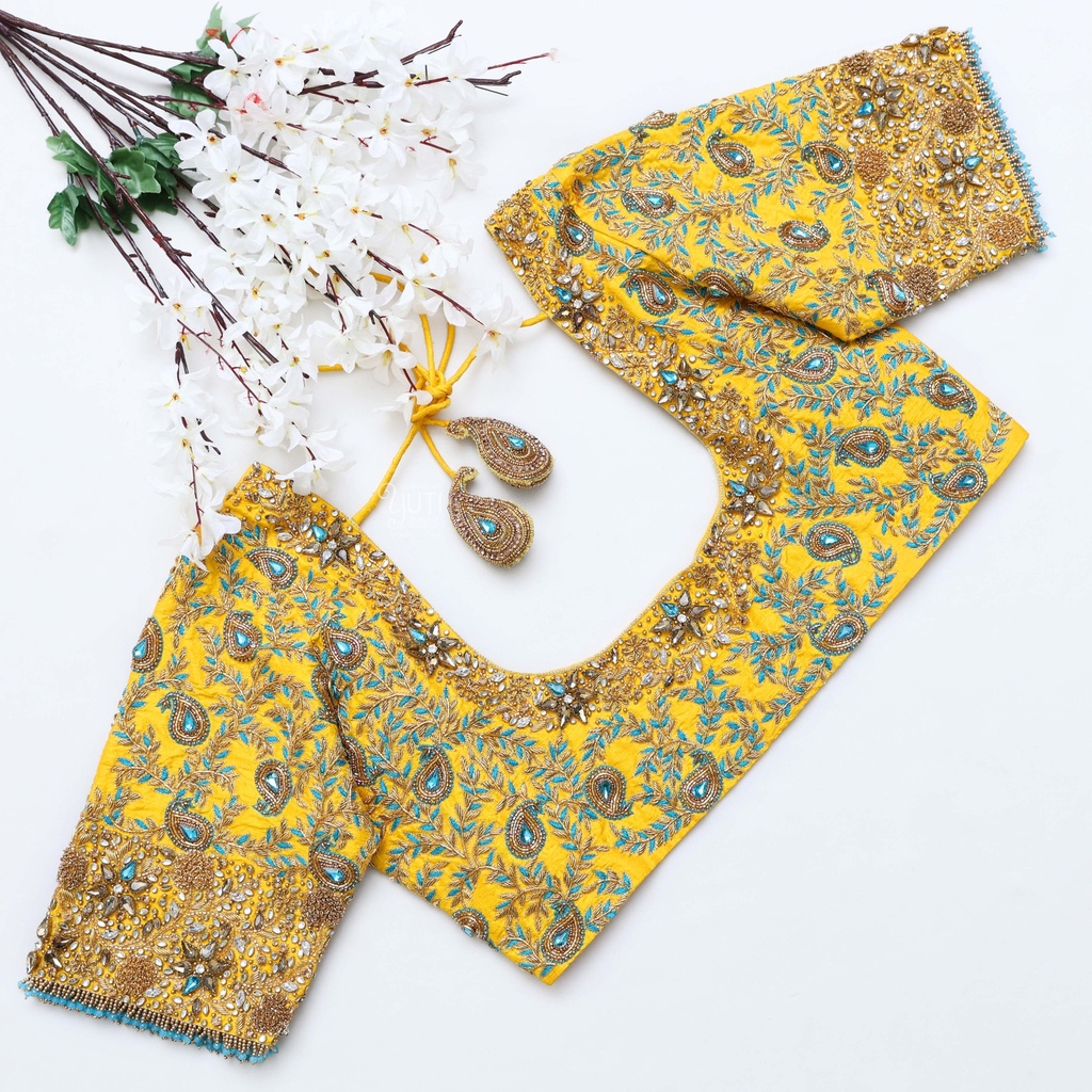 Step up your style game with this captivating yellow embroidery blouse