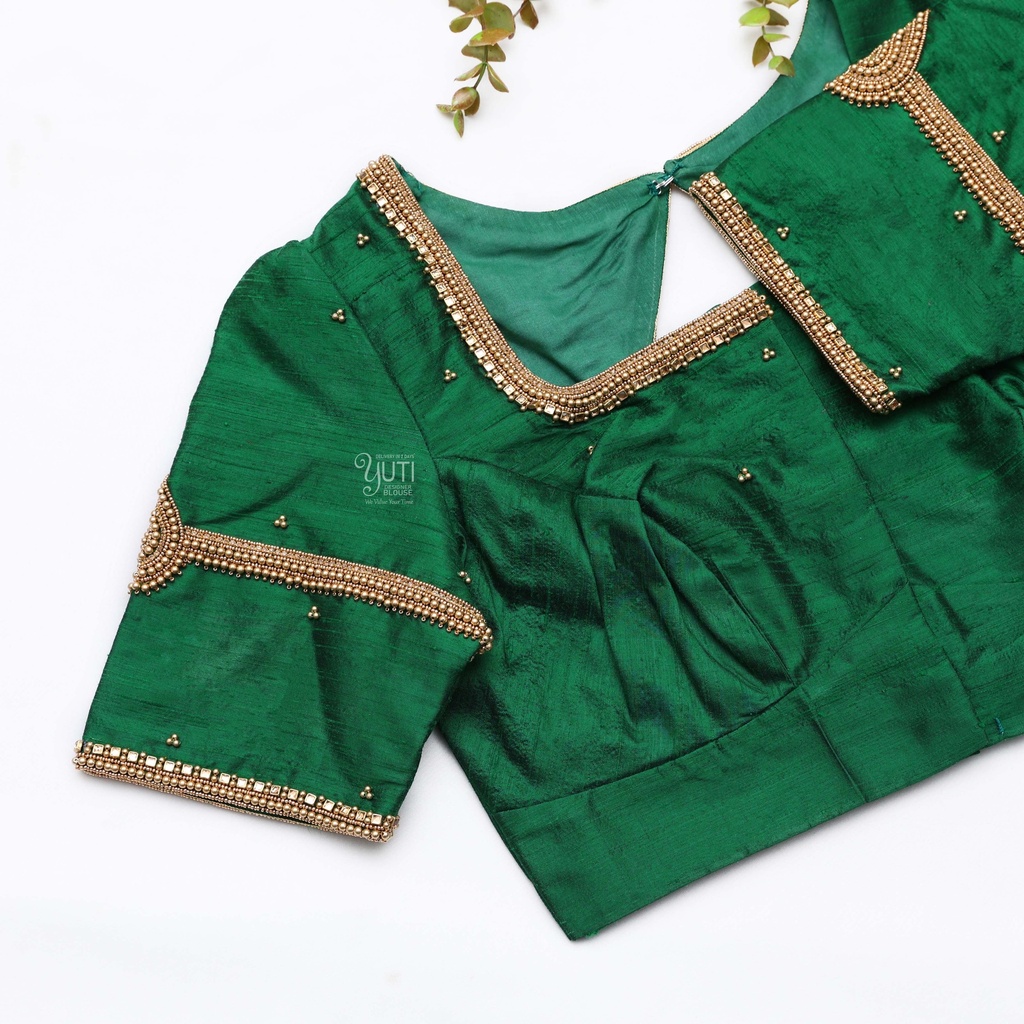 Embrace the elegance of this stunning green blouse