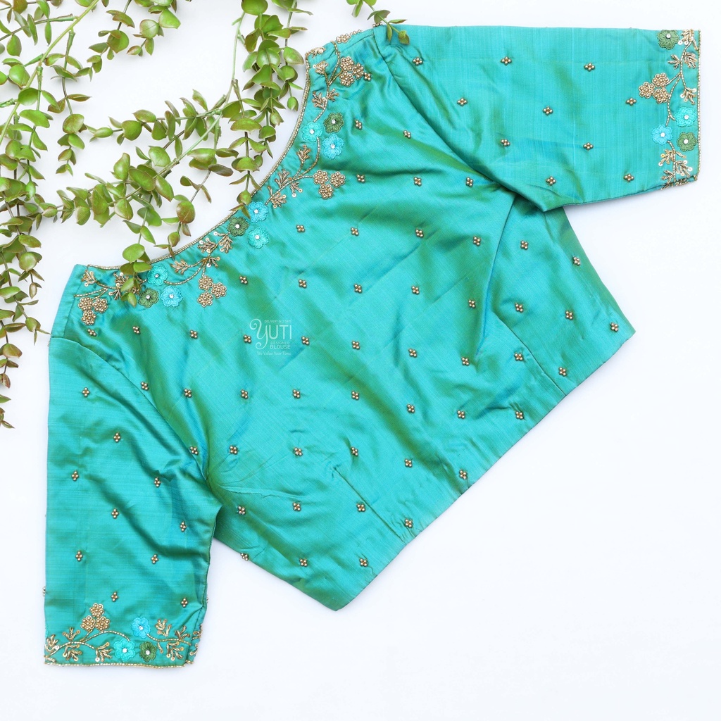Embrace the beauty of nature with this turquoise blue blouse