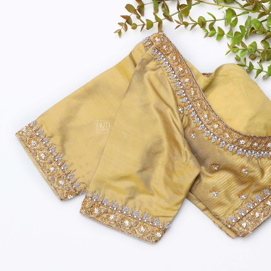 This gold embroidered blouse with beading is the perfect choice