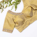 This gold embroidered blouse with beading is the perfect choice