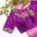 Flaunting the vibrant colors of spring with this purple blouse and its floral design.