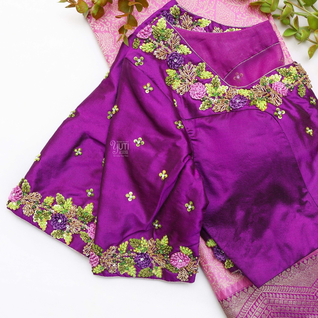 Flaunting the vibrant colors of spring with this purple blouse and its floral design.