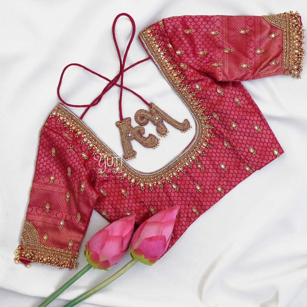 Red blouse with traditional pendant