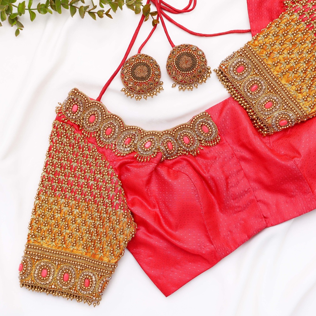 Introducing our stunning Light Red Embroidery blouse!