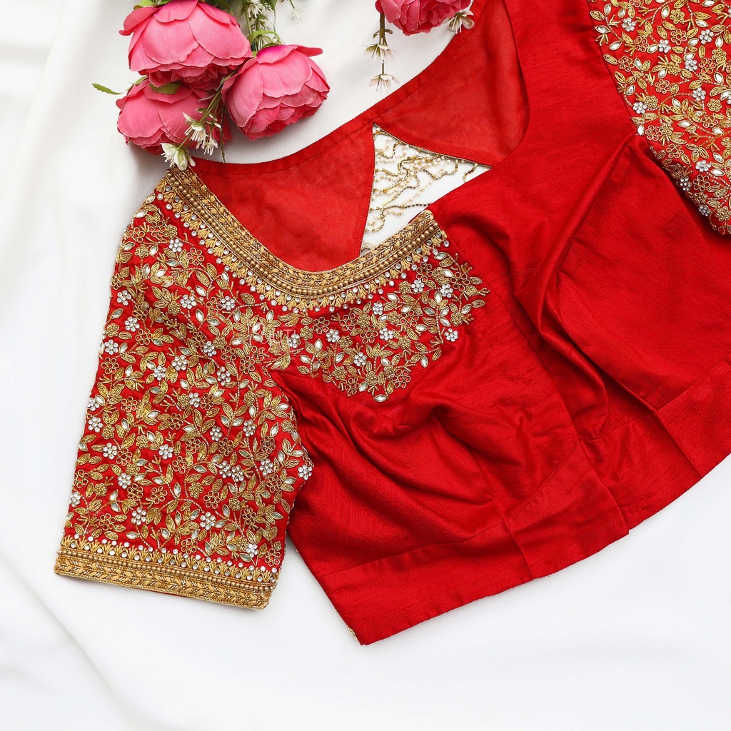 Festive red blouse embellished with gold sequins and lovely flowers.