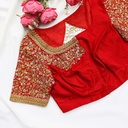 Festive red blouse embellished with gold sequins and lovely flowers.