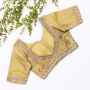 This gold embroidered blouse with beading is the perfect choice