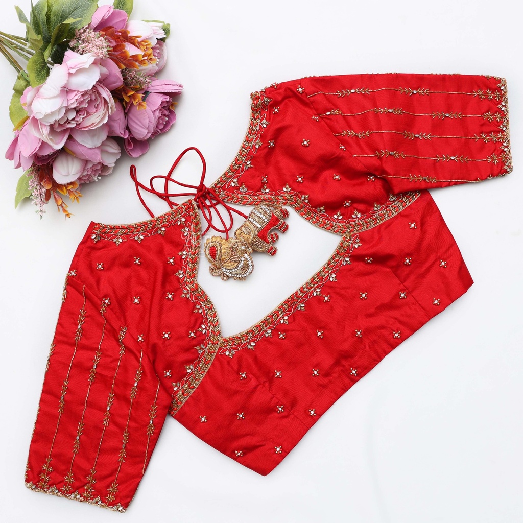 A stunning blend of red and gold, this bridal blouse