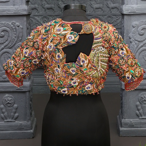The allure of peacock-inspired embroidery on our elegant bridal blouse