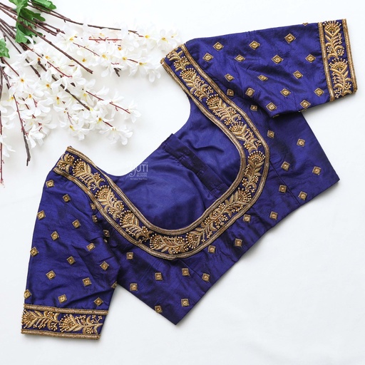 The perfect dark blue bridal blouse with stunning golden embroidery work