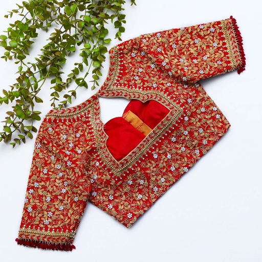 Stunning red blouse adorned with a mesmerizing red and gold pattern.
