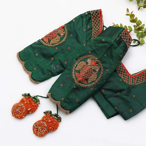 Resplendent green blouse adorned with exquisite red and orange embroidery