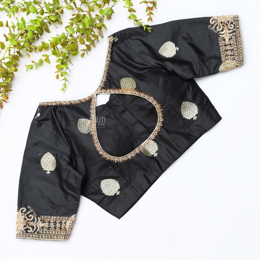 This black silk blouse adorned with intricate gold embroidery
