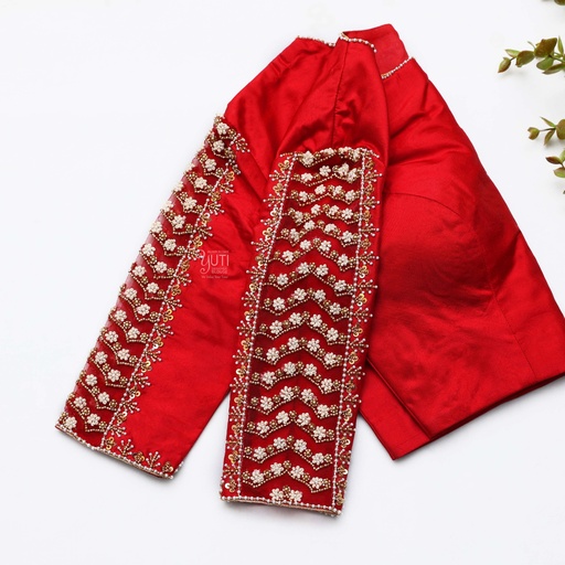A stunning bridal blouse adorned with intricate embroidery